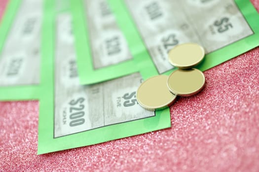 Close up view of green lottery scratch cards. Many used fake instant lottery tickets with gambling results. Gambling addiction concept.