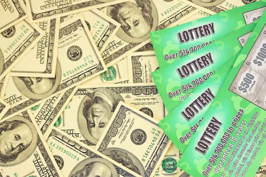 Close up view of green lottery scratch cards and us dollar bills. Many used fake instant lottery tickets with gambling results. Gambling addiction concept.