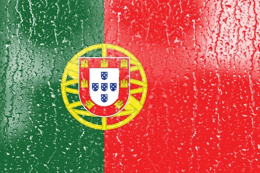 3D Flag of Portugal on a glass with water drop background.