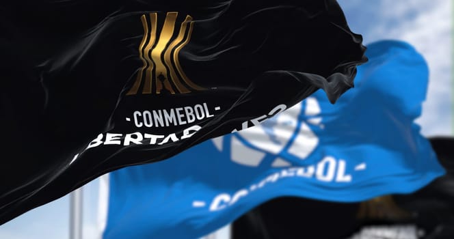 Buenos Aires, ARG, Sept 2022: Flags with the CONMEBOL and Libertadores logo waving. CONMEBOL Libertadores is a South American football competition for club teams and is organized annually by CONMEBOL