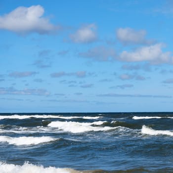 Beautiful sky and sea with waves to the horizon.