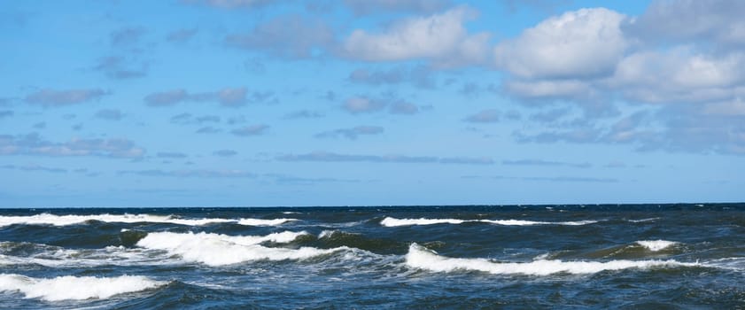 Beautiful sky and sea with waves to the horizon.