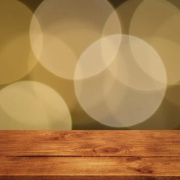 The background is an empty wooden board and a wall of blurred bokeh lights. For product demonstrations, free space, layout, mockup, perspective board, background board.