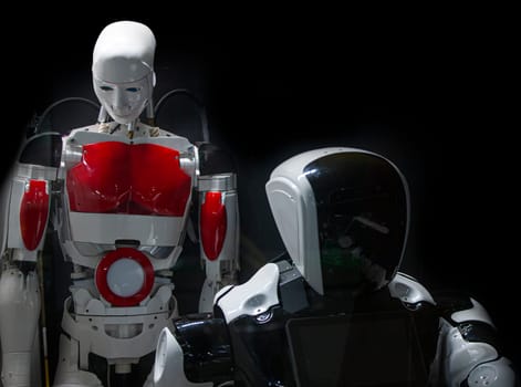 The ANDROID ROBOT made of modern materials on a black background