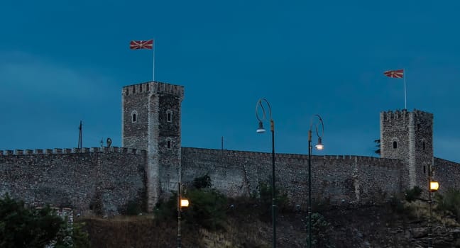 The evening city castle Skopje in Macedonia in the evening and street lamp. Selective focus