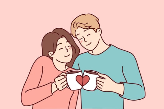 Happy couple hugging drinking coffee from lovers mugs. Smiling man and woman embrace enjoy morning tea from cute cups. Vector illustration.