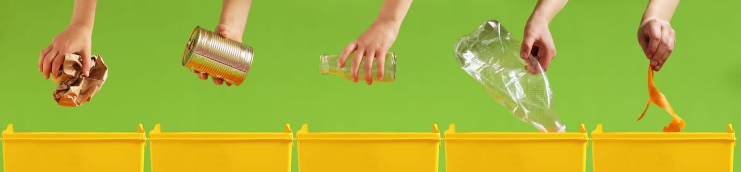 Children's hands throw paper, metal, glass, plastic, organic garbage into different yellow containers on a light green background. Waste sorting. Environment care. Recycling and ecology concept.