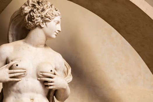 Florence, Italy - circa July 2021. Sensual naked woman statue. Beauty figure made of stone.