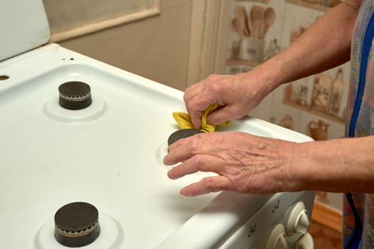 wet cleaning of the gas stove. High quality photo