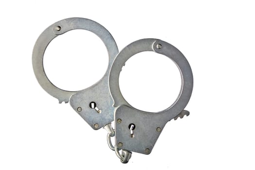 Metal handcuffs on a white isolated background, copy space. High quality photo