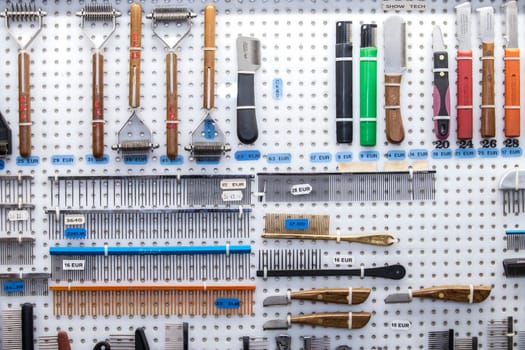 Merida, Spain - Oct 23th, 2022: Dog hair care tools for sell at exhibition enclosure. Canine International Exhibition