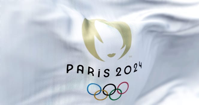 Paris, FR, October 2022: Close-up view of the Paris 2024 Summer Olympics flag waving in the wind. The XXXIII Olympic Games will be held in Paris, France, from 26 July to 11 August 2024.