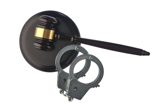 Judge's hammer and handcuffs on white isolated background. High quality photo