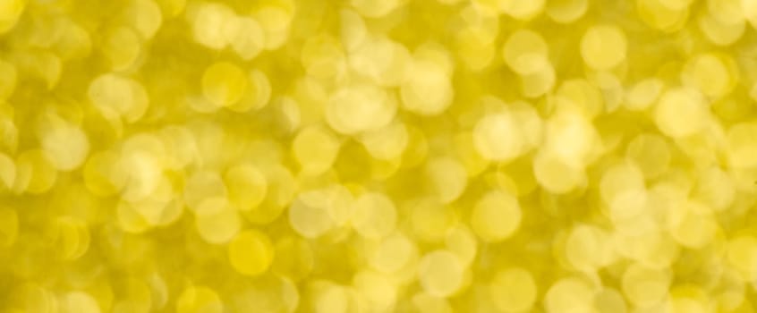 Golden bokeh background for christmas, defocused round lights and sunbeams, flare overlay