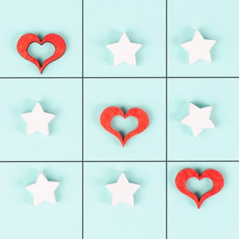 Tic tac toe game with red hearts and stars, symbol for love and emotion, valentines day