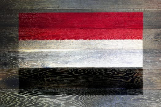 A Yemen flag on rustic old wood surface background