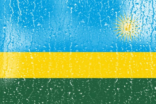3D Flag of Rwanda on a glass with water drop background.