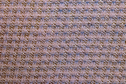 Pink fabric texture. Close-up of an elastic red nylon fabric with seamless pattern for sports equipment, backpacks, bags or other garments. Macro.
