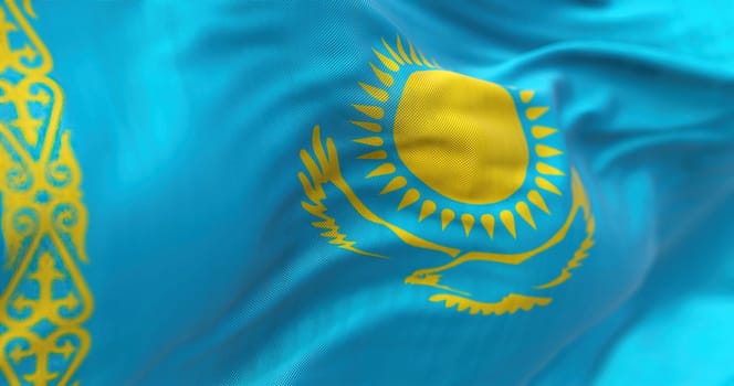 Close-up view of the Kazakhstan national flag waving. The Republic of Kazakhstan is a transcontinental state straddling Asia and Europe. Fabric textured background. Selective focus