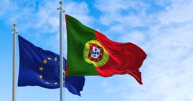 The national flag of Portugal waving in the wind with the european union flag on a clear day. Democracy and politics. European country. Selective focus.