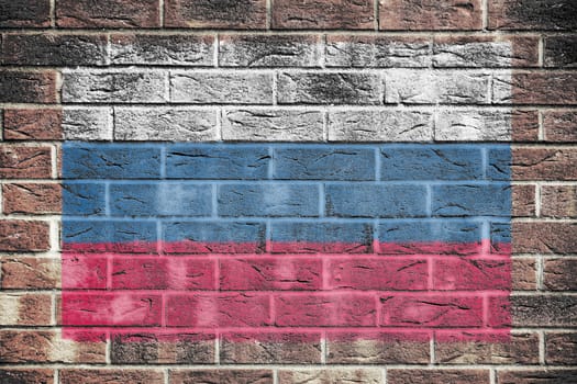 A Russian Federation flag on old brick wall background
