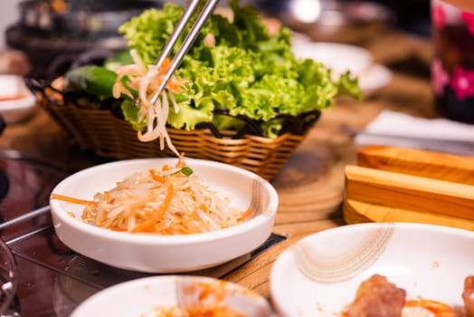 Spicy Kimchi group. Korean pickle or Pickled radish vegetables set and seasoning on bowl on stove serve wood table background, Japanese food