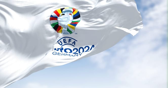 Berlin, Ger, October 2022: The flag of UEFA Euro 2024 flying in the wind. The 17th edition will take place from 14 June to 14 July 2024 in Germany. Selective focus. International sport event