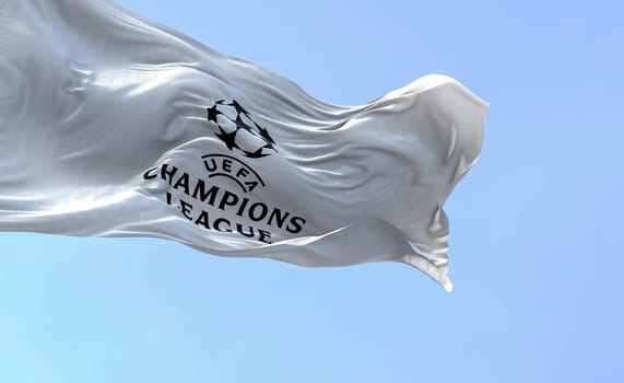 Istanbul TUR, July 2022: The UEFA Champions league flag waving on a clear day. Champion League is the most prestigious club competition in European football. Fabric textured background.