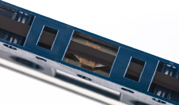 Cassette music tape in detail from above isolated over white background