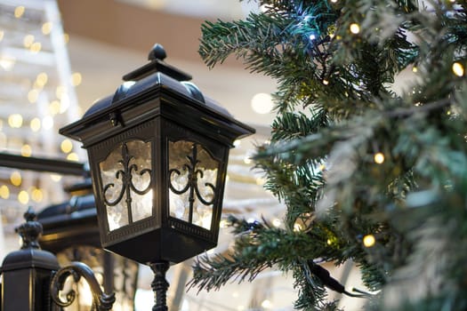 Street lamp decoration beside Christmas tree with led