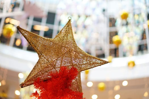 Star display for Christmas decoration. Blur bokeh background