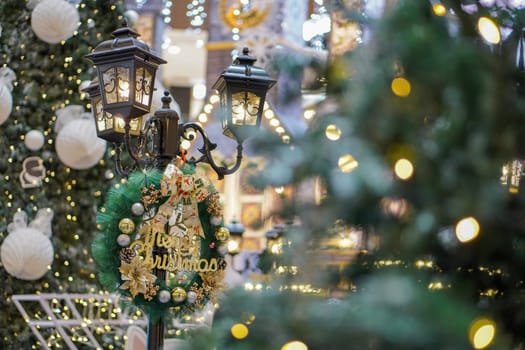 Beautiful Christmas wreath and lamp decoration with led light bokeh. Christmas, winter holiday concept