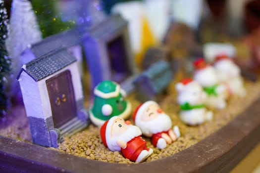 Selective focus Christmas santa figurine display. Christmas winter decoration concept