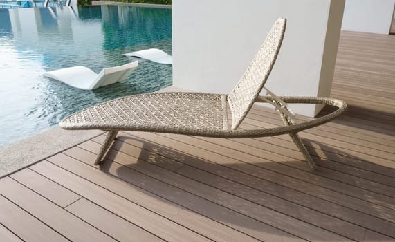 Outdoor leisure lying bed beside swimming pool