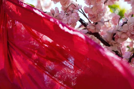 Red fabric and plum blossom decoration at outdoor