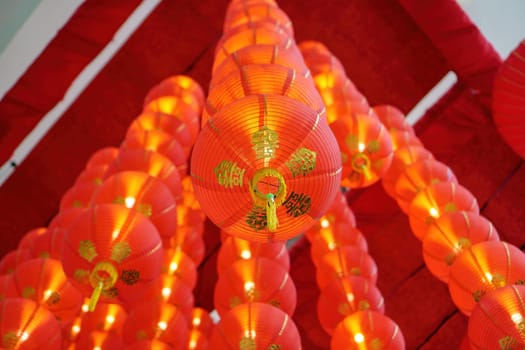 Select focus group of red lantern decoration in row