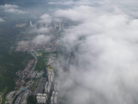 Morning low cloud over apartment and condominium at Paya Terubong.