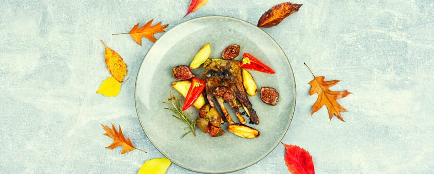 Lamb meat on the ribs, roasted with figs. Grilled lamb ribs