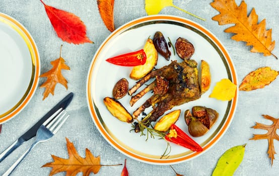 Lamb meat on the ribs, roasted with figs. Grilled lamb ribs