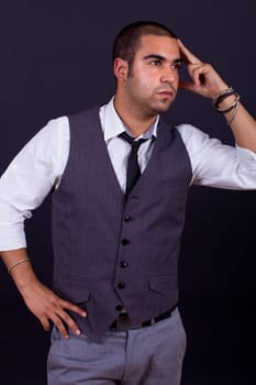 pensive business man portrait on black background