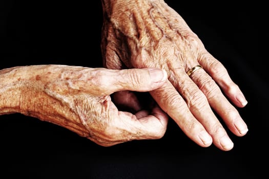 The aching hands of an old woman. An old woman has pain in her hands