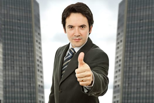 an young business man going thumb up