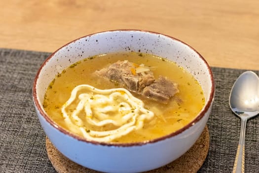 Close up shot of the of the mud bowl with the soup