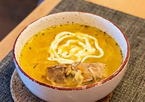 Close up shot of the of the mud bowl with the soup
