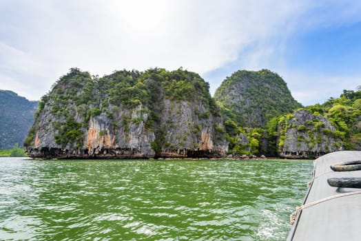 Beautiful landscape of island sea and sky in summer as tourists are happy with the canoeing at Tham Lod cave in Ao Phang Nga Bay National Park, Thailand