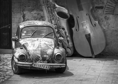 NIS, SERBIA - JULE 18, 2021: Volkswagen Beetle retro car parked near the main entrance to the Nis Fortress in Nis, Serbia.