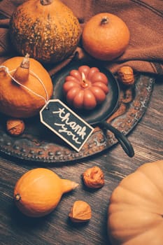 Happy Thanksgiving Day background, wooden table decorated with Pumpkins and Candles