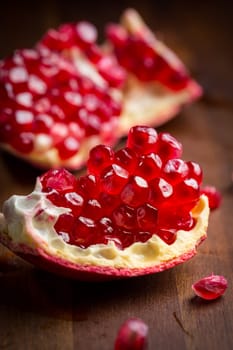 Fresh ripe pomegranate on cutting board