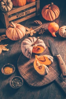 Pieces with ripe pumpkin seeds on a cutting board, prepared for cooking