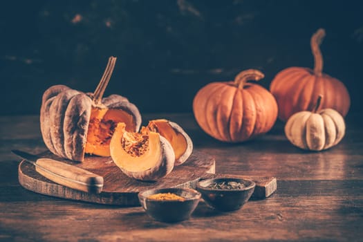 Pieces with ripe pumpkin seeds on a cutting board, prepared for cooking